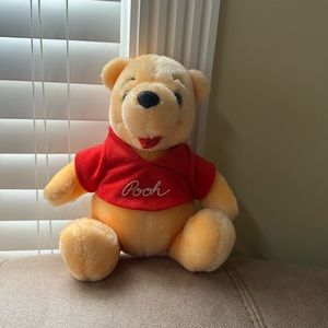 Vintage Walt Disney Winnie the Pooh plush toy.